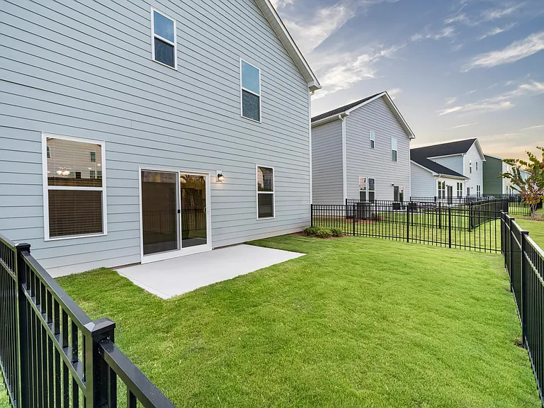 A private, fenced backyard at Amavi Brier Creek, extending your living space outdoors in a quiet Durham setting near everyday conveniences.