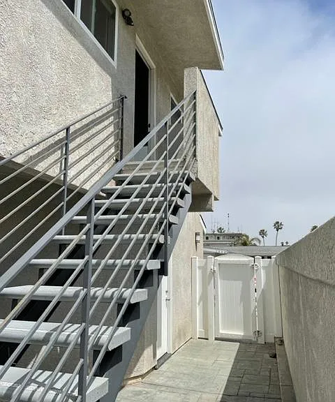 Private access to interior courtyard from garage plus entry to second floor apartment