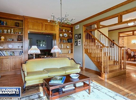 Living Room-I Love the Custom Built in's and Transom Windows in the Opening from the Foyer.