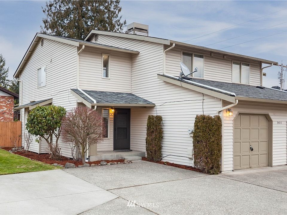 The townhome is nicely set back from the cul-de-sac street by a decently sized driveway, providing space for off-street parking in addition to the enclosed attached garage