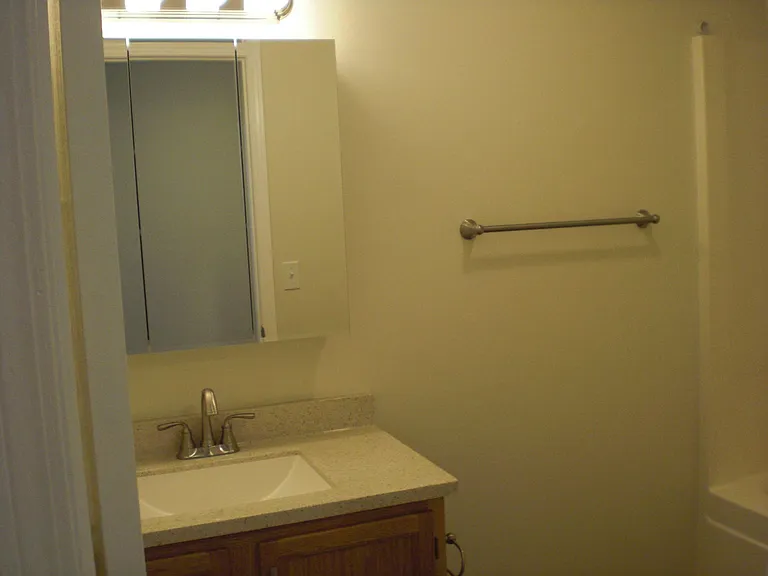 upstairs bathroom with tub and shower