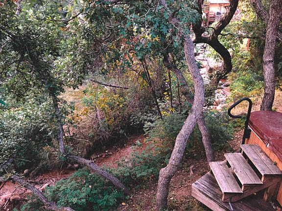 Relax in the Hot Tub near the creek.