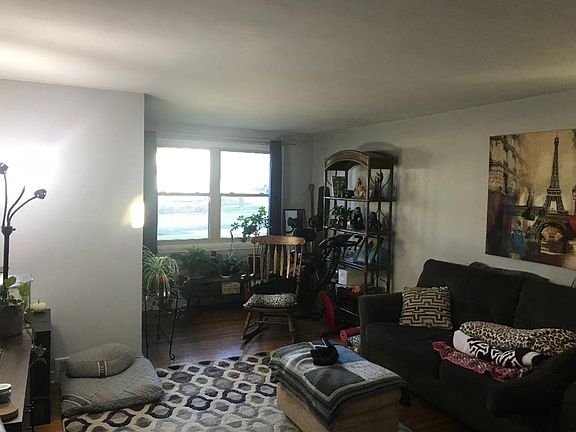 Living room, has a coat closet by front door.