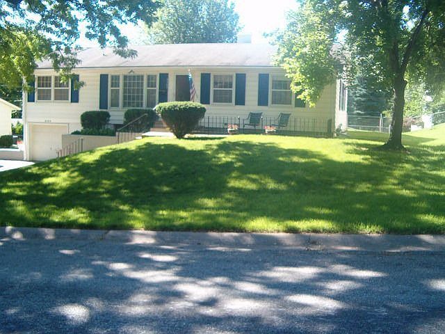 Frontyard and Doublewide Driveway with Flowerbed and Patio