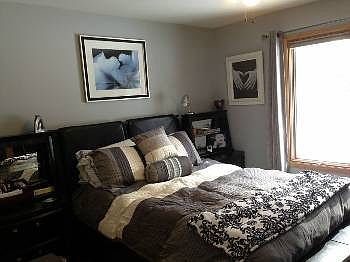 The master suite sits in the back of the home offering added peace and privacy.  This room features a very large closet that is big enough to be considered a walk-in and it's own private bath.  One can't help but love the dcor.