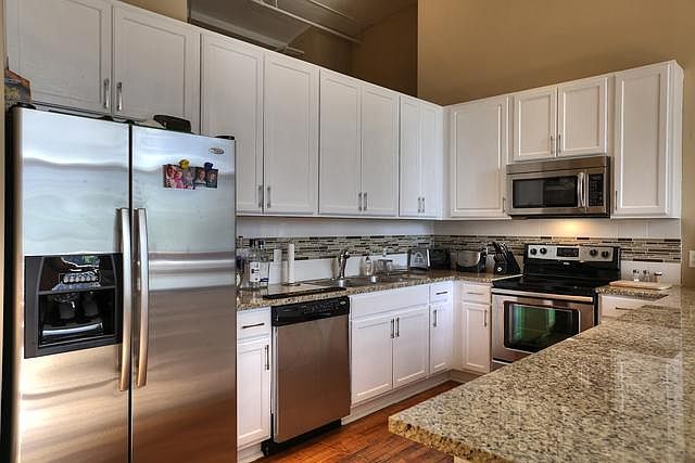 kitchen with granite counter tops and stainless steel applia