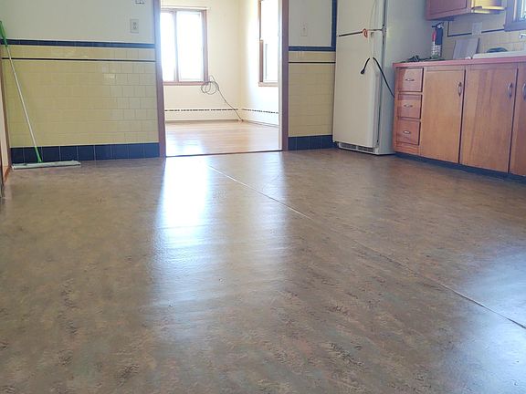 Entry into Kitchen from stairway at side door.