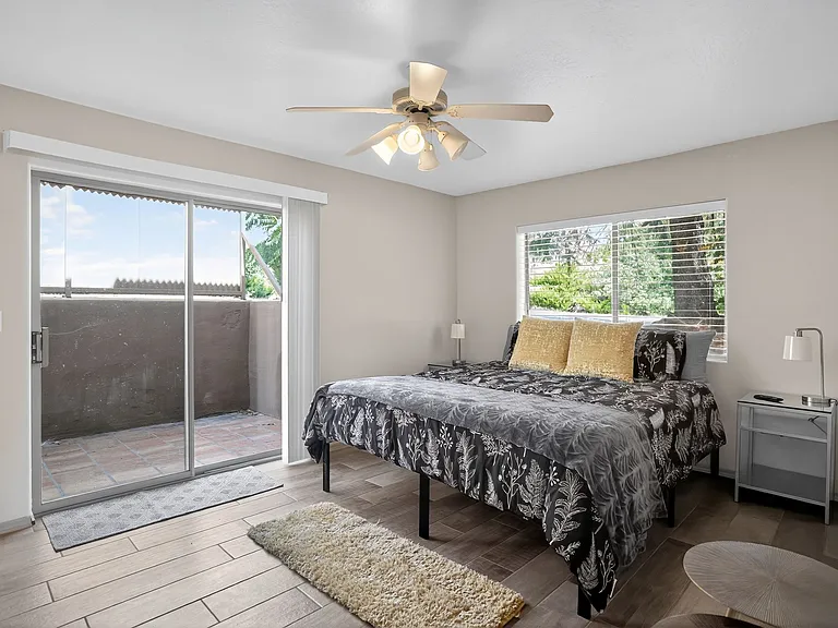 Master Bedroom sized well, with access to outdoor patio with sliding glass door.
