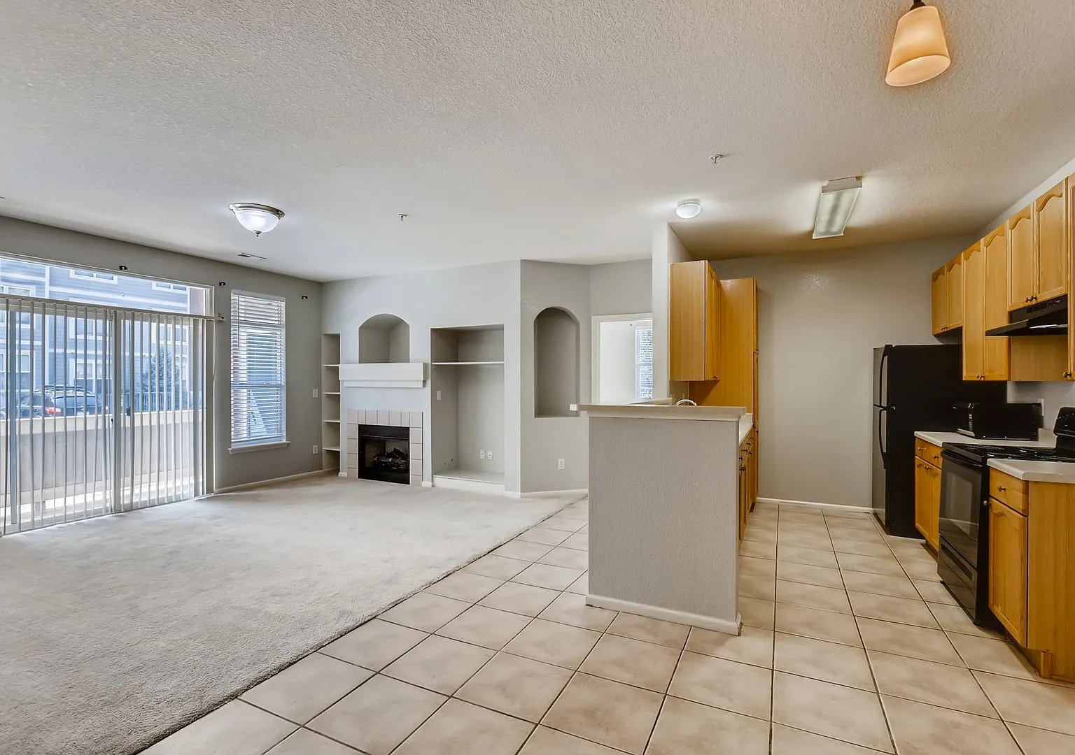 Bright 2-Bedroom Aurora Condo | Fireplace, Balcony + Community Pool — Photo 3
