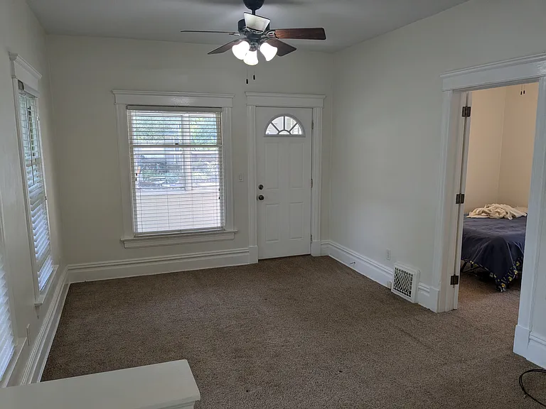 Living Room
(Open door on the right is the door to Bedroom 1. The closed door to the left is the door to the screened porch.)