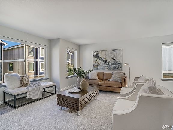 Welcome to this elegant and most stylish turn key ready home. The Space, natural light (From all those windows) and open floor plan will wow you! All new wood like plank flooring and interior paint.