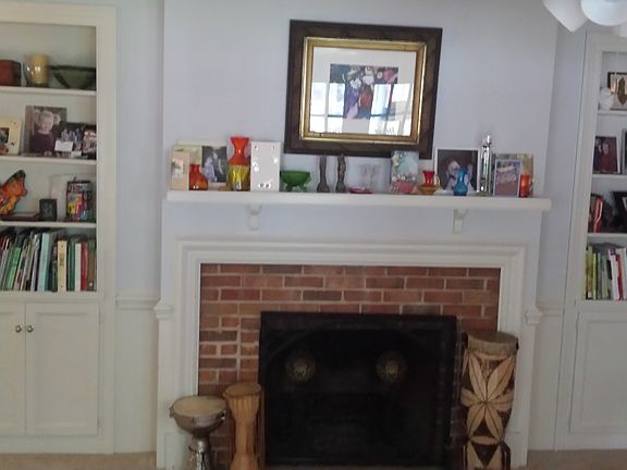 wood burning fireplace in den