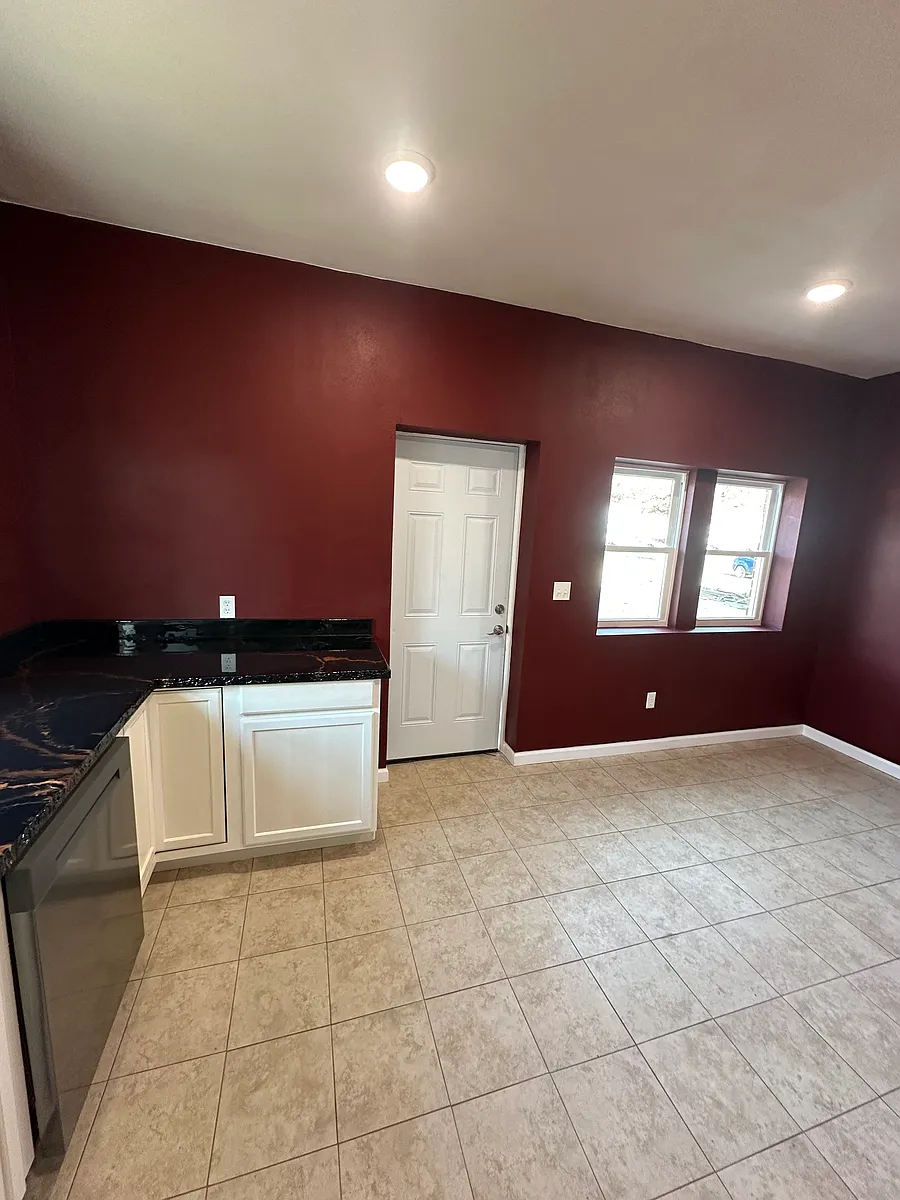 Kichen dining room ara to the right big enough for a large dining room table. Door goes outside to the parking lot. Great way to bring in groceries. - 108 S Osage St #B