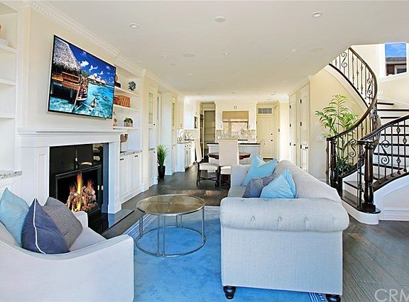 Great room with view to dining area and beautiful staircase