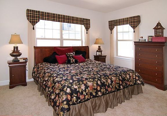 Master bedroom with adjoining walk in closet and bathroom