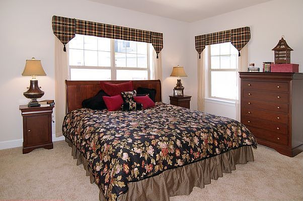 Master bedroom with adjoining walk in closet and bathroom