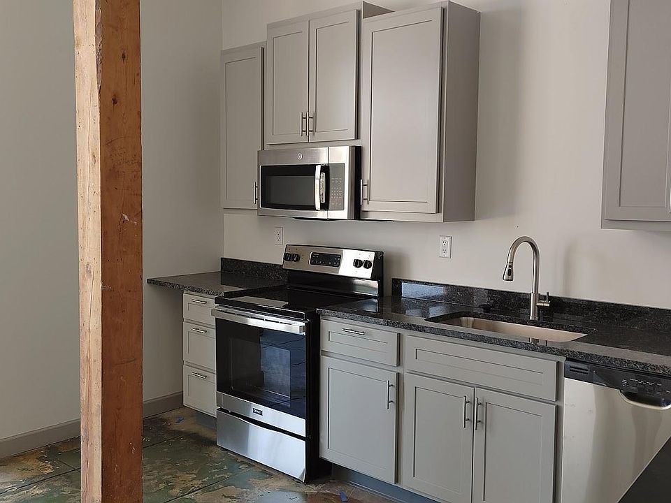 pale grey cabinets with granite counters