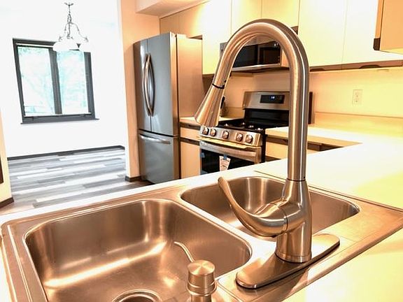 Spacious Kitchen with Double Window Breakfast Nook and ALL New Stainless Steel Appliances plus New Luxury Vinyl Laminate Plank Flooring