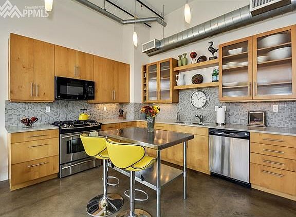 kitchen with stainless steel appliances and custom cabinets