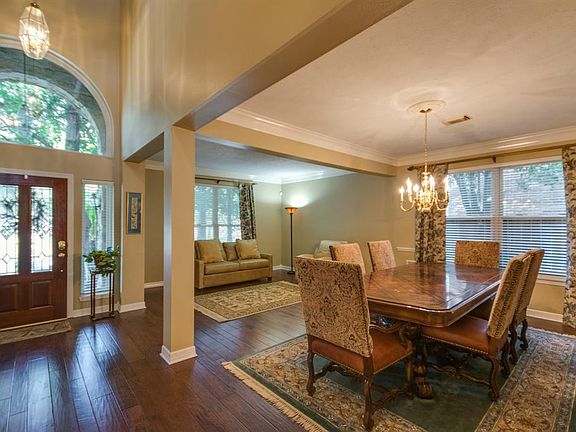 The gorgeous hardwoods continue throughout the dining room and den.