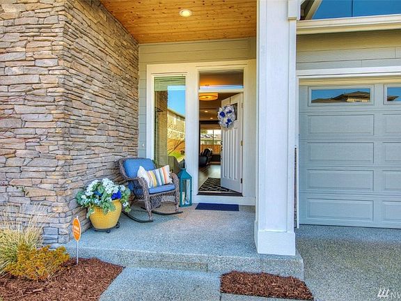 Inviting covered entry; notice the beautiful stone wall.