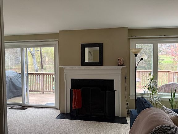 Living room with deck and park