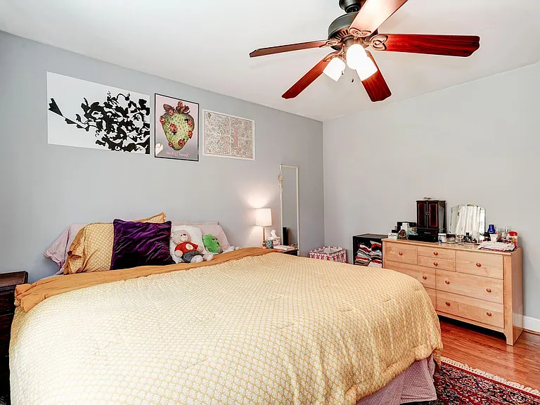 Bedroom boasts lighted ceiling fan, deep closet and windows + room for dressers and/or desk