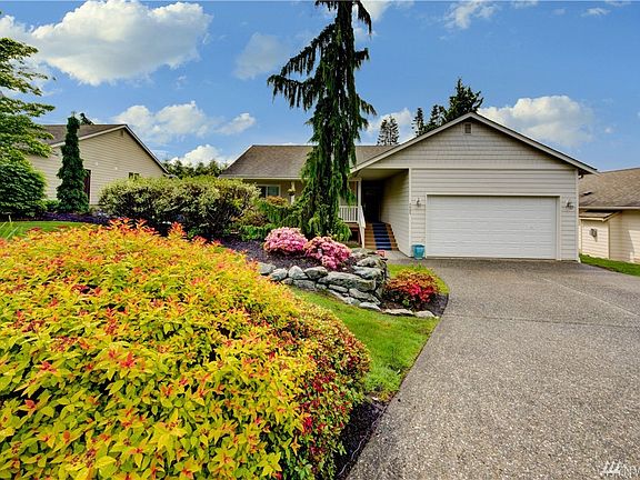Colorful landscape gives the home great curb appeal. 