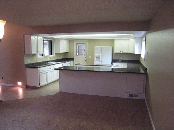 Looking at kitchen from the dinning room. Large and open.