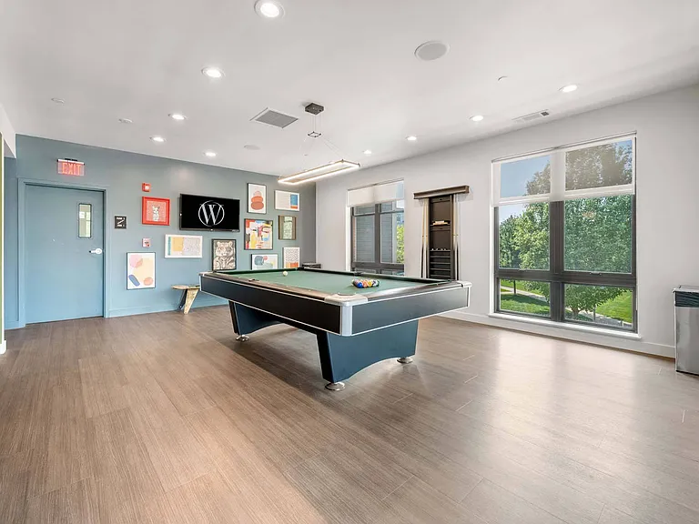 Challenge a friend to a game at the billiards table, a fun spot to unwind and connect.
