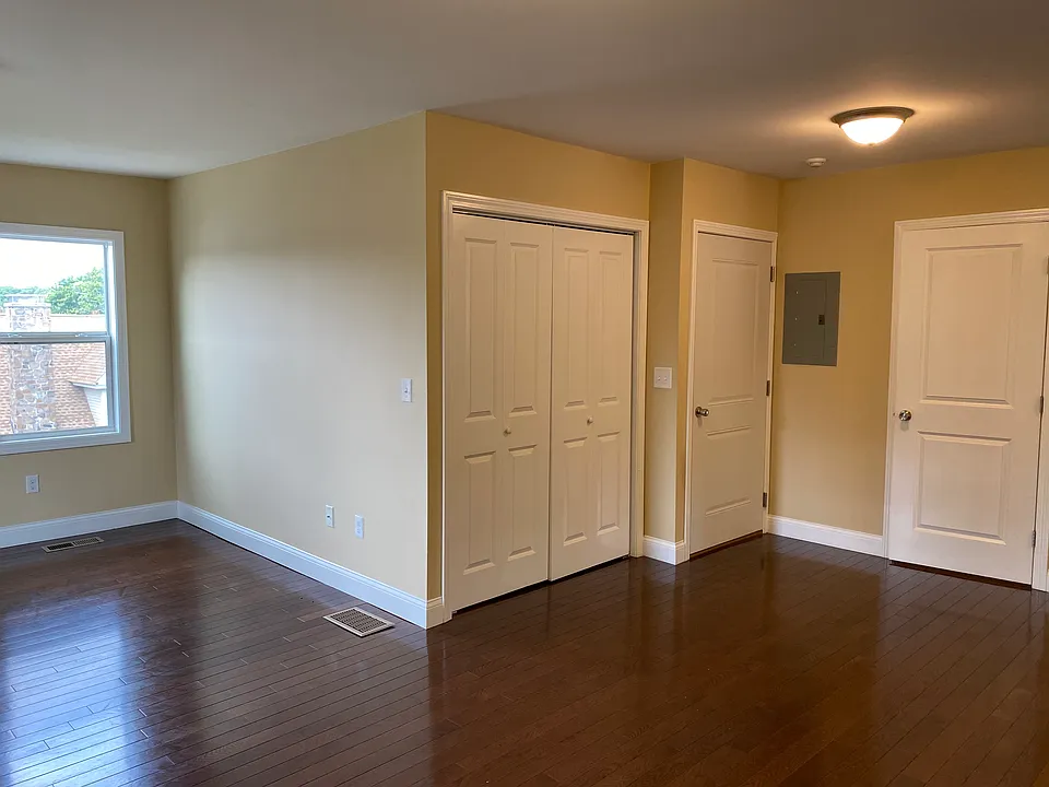 View of back entry & closets from dining area