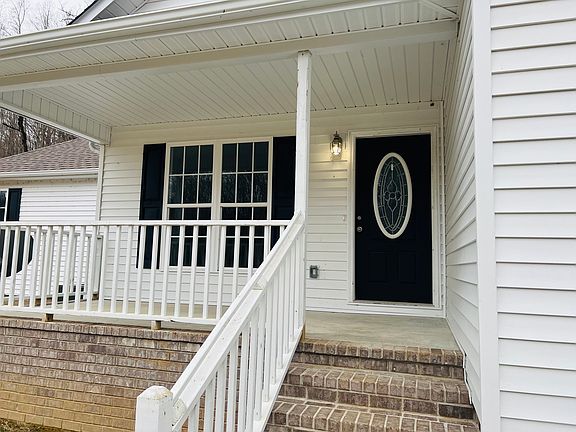 Inviting front porch, great for sitting and enjoying the country views.