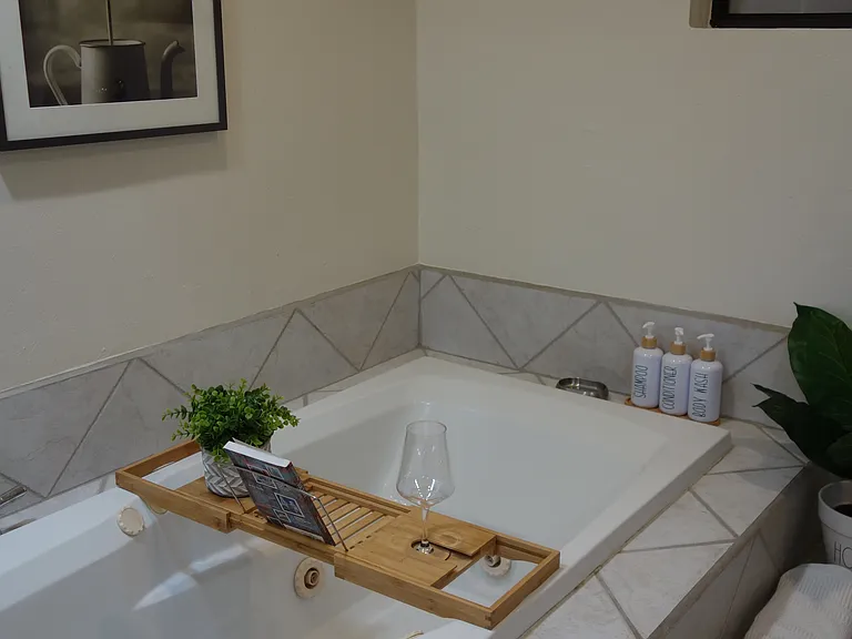 Walk-in shower and jetted tub for a spa-like experience.