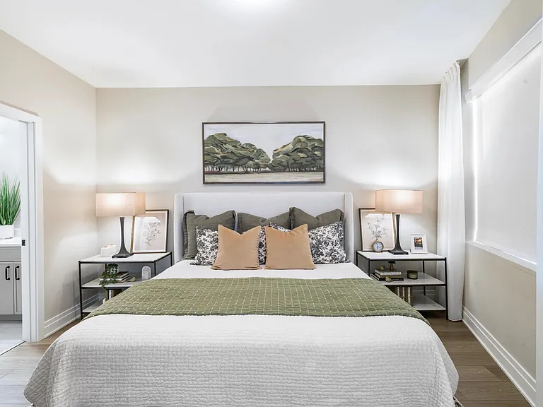 Serene tones, layered textures, and a calming layout create a bedroom that welcomes rest, recharge, and a slower start to your day.