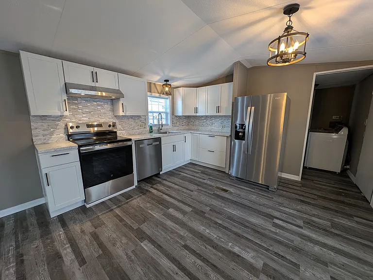 Kitchen with newer cabinets and appliances.