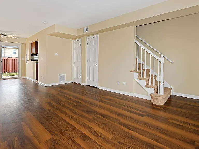 Living room opens to a private patio