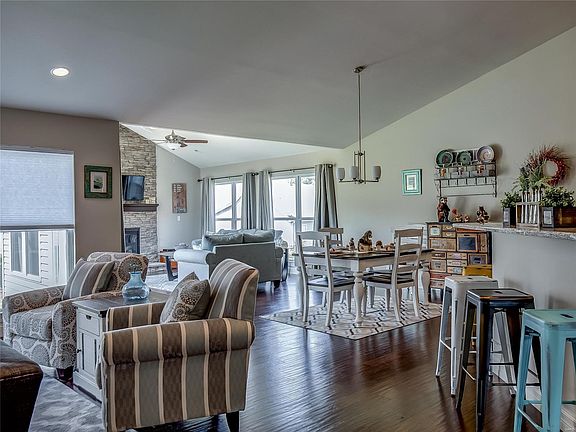 Huge Open Concept with vaulted ceiling includes kitchen, breakfast room, hearth room, living room and dining room (not shown here). Wood floors throughout.