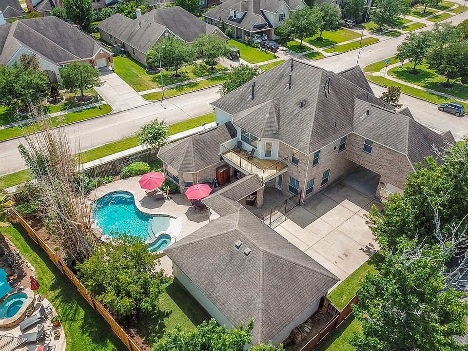 Desirable corner lot with over 13,000 sq ft, 4 car garage, gated driveway and tons of space for outdoor play!