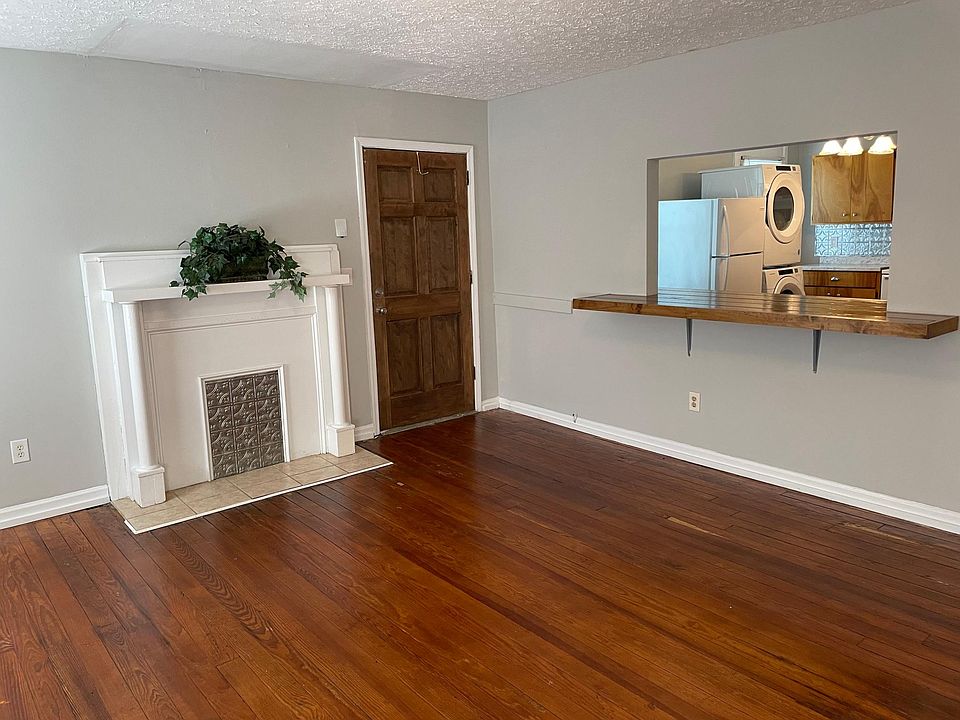 Living room, back entrance, and pass through bar