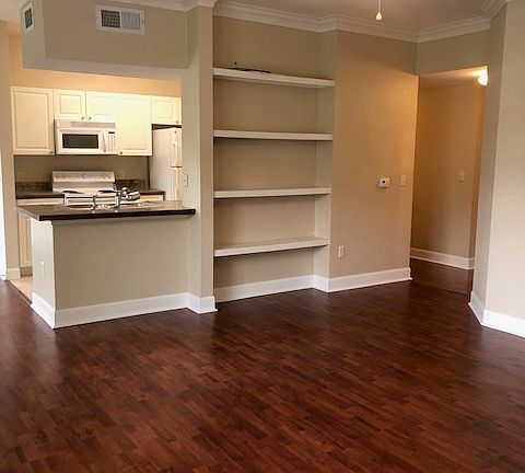 Another view of the living room and kitchen