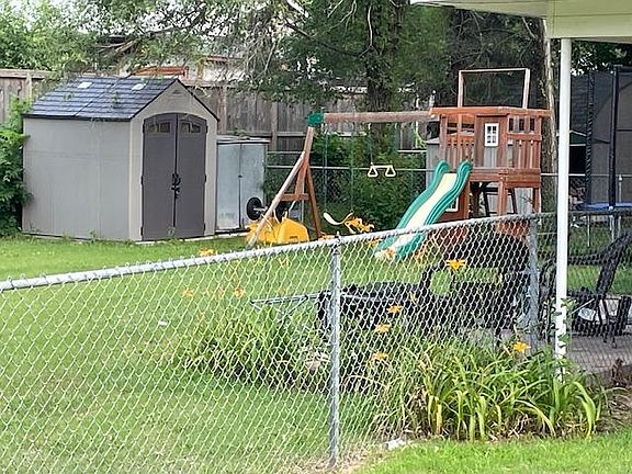 Backyard & shed. No playset. Belongs to current tenant.