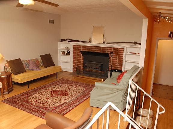 Upper and lower living area. Woodstove is inoperable due to earthquake. Ceiling fan here and in kitchen.