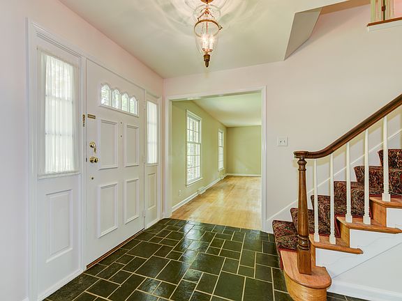 Black slate flooring in center hall foyer