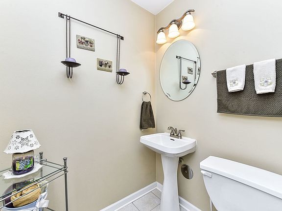 The powder room on the main level, located off the foyer.