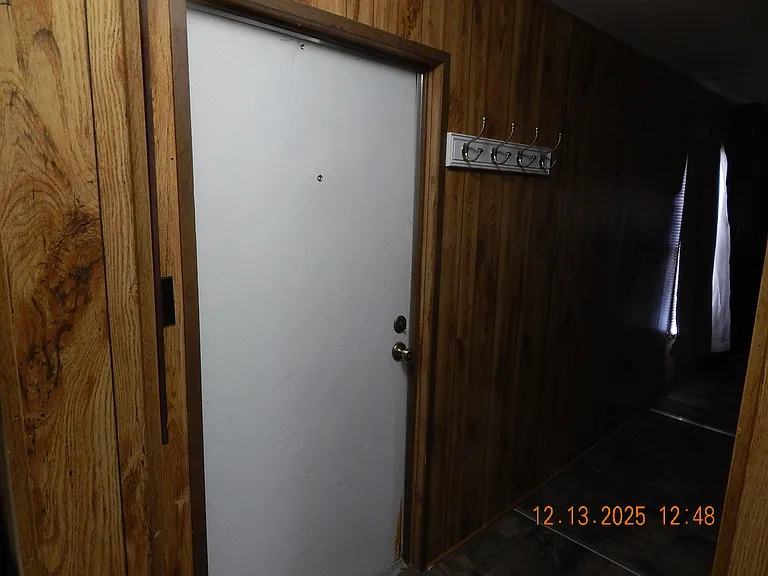 Rear house entrance door - showing hooks to hang your coat and hat.