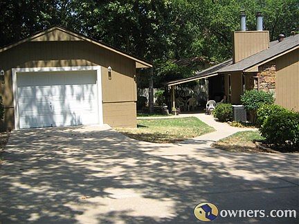 View of back Garage, House,and Patio