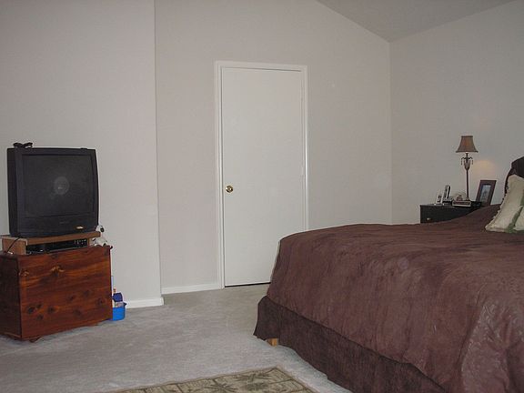 Master bedroom from window seat (door is master bathroom)