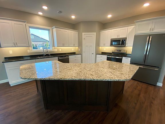 All new appliances, well lit granite counter tops, large pantry