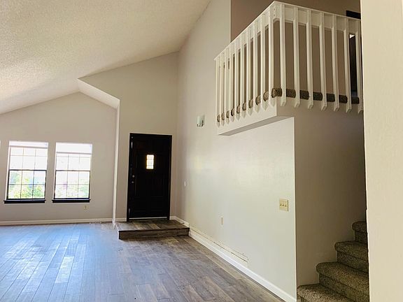 Entry, living room and upstairs loft.