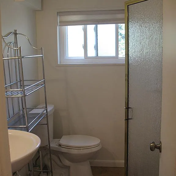 Bathroom with stall shower.